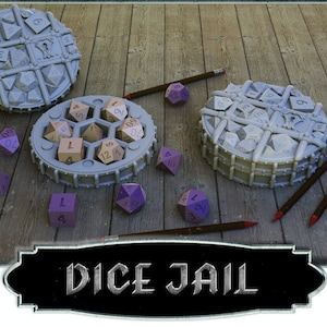 May include: A gray and white dice jail with a lid open, revealing a set of wooden dice. The dice jail is on a wooden surface with purple dice scattered around it. The text "DICE JAIL" is on a black and silver sign.