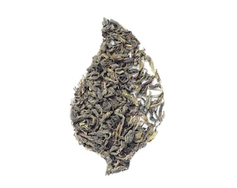 May include: A green tea leaf shape made from loose leaf tea.