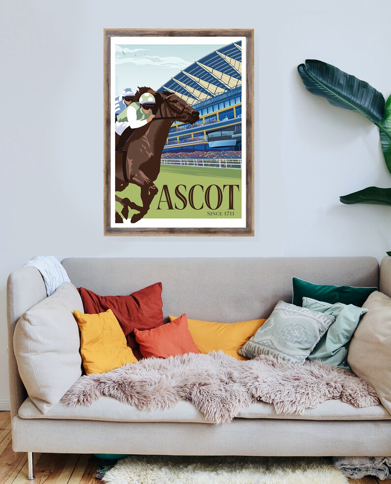 May include: A framed art print featuring a horse race scene at Ascot. The illustration depicts a brown horse with a jockey in green and white racing attire. The word "ASCOT" is prominently displayed, with "SINCE 1711" below.