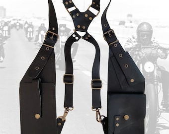 May include: Black leather shoulder holster with two pockets and adjustable straps. The holster has a Y-shaped strap design and is made of high-quality leather.