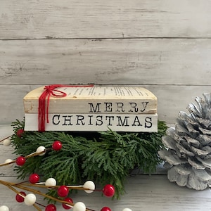 merry christmas stamped stacked books, farmhouse books, Christmas stamped books, Christmas bookstack, Christmas stacked books