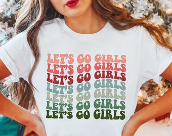 May include: White t-shirt with the text "Let's Go Girls" repeated in a rainbow of colors.