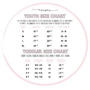 May include: A chart with sizing information for youth and toddler unisex t-shirts. The chart includes size, width, length, and age ranges. The chart is in a circle with a pink background.