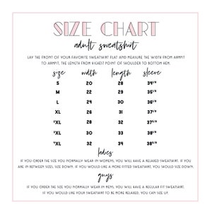 May include: Size chart for adult sweatshirts with measurements in inches for width, length, and sleeve length. The chart includes sizes S, M, L, XL, 2XL, and "XL".