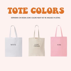 three tote bags in different colors: white, light cream, and pink.