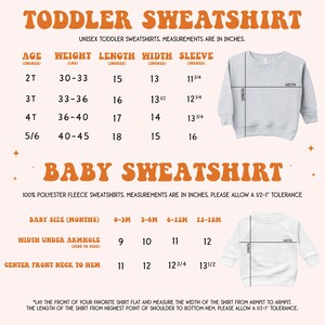 a baby sweater with measurements and measurements for it