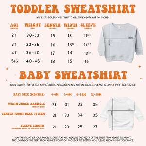 a baby sweater with measurements for a toddler sweater