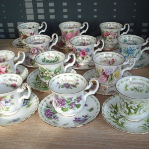 Royal Albert flower of the month complete set of 12 coffee cups and saucers in beautiful condition, also the edges
