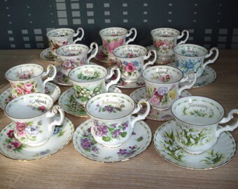 Royal Albert flower of the month complete set of 12 coffee cups and saucers in beautiful condition, also the edges