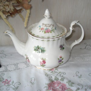 Royal Albert Flower of the Month medium teapot in beautiful condition, the gold edges also appear not to have been used