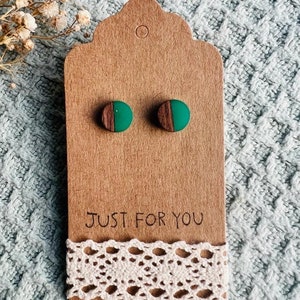 May include: A pair of green and brown wood earrings on a brown card with the text "Just for you".