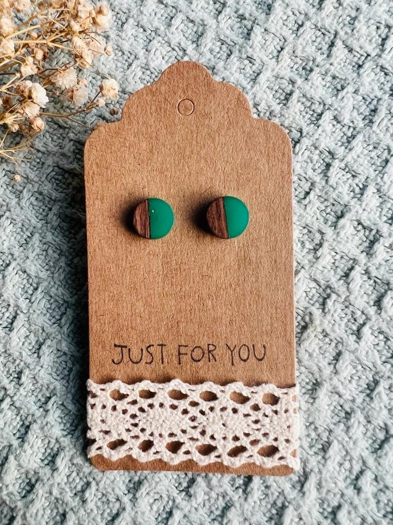 May include: A pair of green and brown wood earrings on a brown card with the text "Just for you".