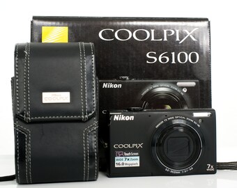Nikon Coolpix 6100. Includes box, leather case, manual, 2.0GB card, battery and charger.