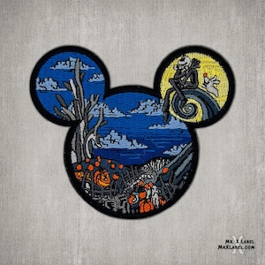 May include: A black and white embroidered patch shaped like Mickey Mouse's head. The left ear features a dark forest scene with a blue sky and clouds. The right ear features a yellow moon with a silhouette of Jack Skellington from The Nightmare Before Christmas.