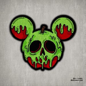 May include: Green and red embroidered patch of a skull-shaped apple with dripping green goo, shaped like Mickey Mouse ears.