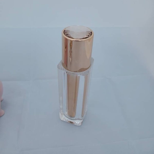 empty lotion bottle, empty fancy bottle in rose gold