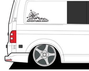 May include: A white van with a black compass and mountain graphic on the rear window. The graphic says "Adventures Await".