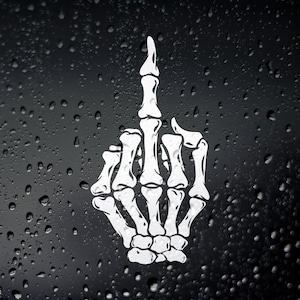 May include: A white, skeletal hand displaying the middle finger, set against a dark backdrop with water droplets. The graphic is a striking, high-contrast design, suitable for stickers or decals.