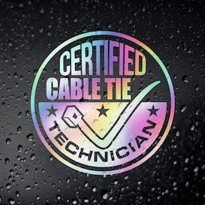 May include: A circular sticker with iridescent text and design elements. The text reads "CERTIFIED CABLE TIE TECHNICIAN" in a rainbow gradient. A checkmark and cable tie graphic are also present. The sticker has a black background with water droplets.