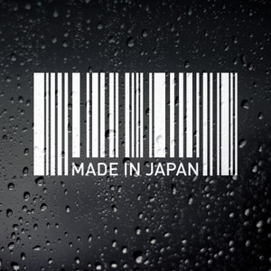 May include: A white barcode sticker with the text "MADE IN JAPAN" on a black background with water droplets.