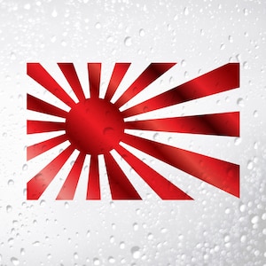 以下が含まれることがあります： 中央に赤い円がある赤と白の日の丸のステッカー。ステッカーは水滴のある白い背景に貼られています。