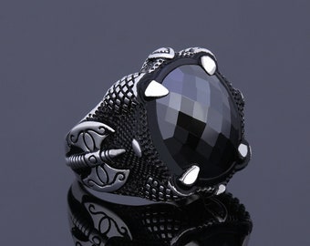 Koop Brede zilveren ring gezet met licht blauwe stenen en cubic zirconia van de designer