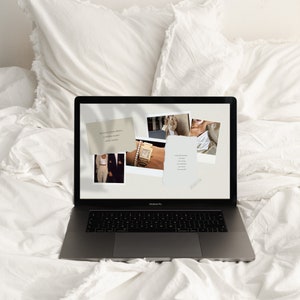 May include: A laptop computer with a white background. The screen displays a collage of images, including a watch, a woman in a dress, and a couple in a photo booth. The text on the screen reads "The secret of your future is hidden in your daily routine."
