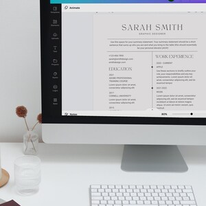 May include: A computer monitor displays a resume template with the text "Resume + Cover Letter Builder" at the top. The resume includes sections for education and work experience. A keyboard and notebook are in the foreground. Text on the screen says "Easily edit in CANVA."