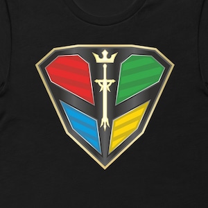 May include: Black t-shirt featuring a gold, diamond-shaped emblem with a sword and a crown. The emblem is divided into four sections: red, green, blue, and yellow.
