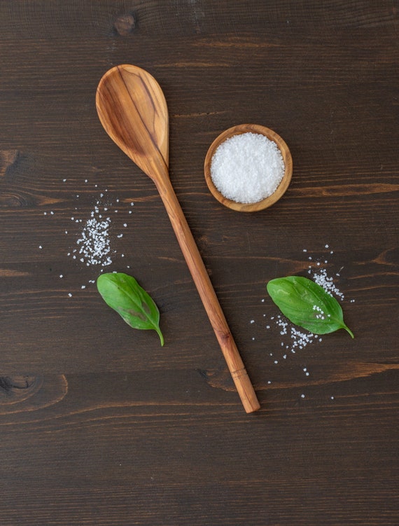 A $10 handcarved Greek olive wood spoon with 55 favorites is a rare combo: genuine artisan craft, incredibly giftable, and priced so anyone can say yes.