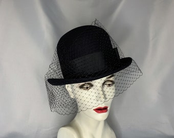 Couture tall bowler hat in black with veil