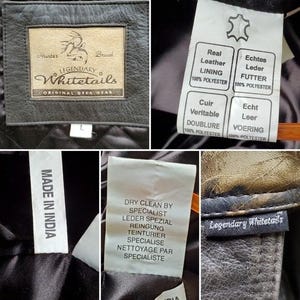Op de afbeelding: Close-up van een zwarte leren jas met meerdere labels. E&eacute;n label luidt "LEGENDARY Whitetails ORIGINAL DEER GEAR". Andere labels geven "Echt Leer" en "Made in India" aan. De jas heeft een gewatteerde voering.