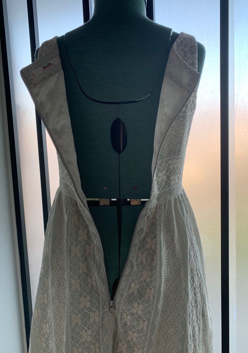 Dizzlin Pastel Mint Green Short Skater Dress Size S withWhite LaceScoop NecklineSlash PocketsBack Zipper Up ClosureFull Lining