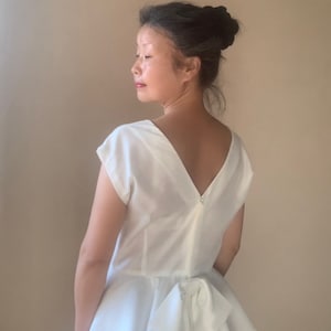 60s Style White Sheath Dress: V-Back Peplum Bow, S-M