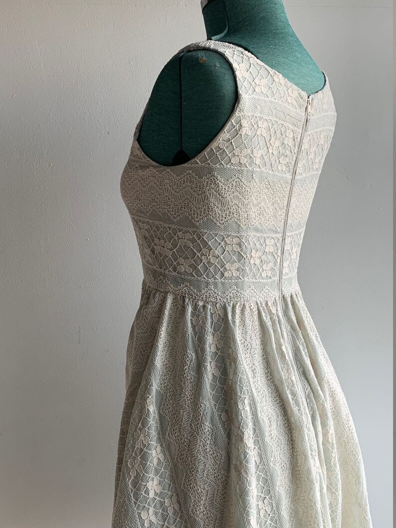 Dizzlin Pastel Mint Green Short Skater Dress Size S withWhite LaceScoop NecklineSlash PocketsBack Zipper Up ClosureFull Lining
