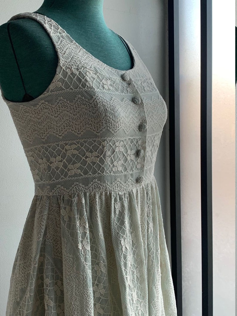 Dizzlin Pastel Mint Green Short Skater Dress Size S withWhite LaceScoop NecklineSlash PocketsBack Zipper Up ClosureFull Lining
