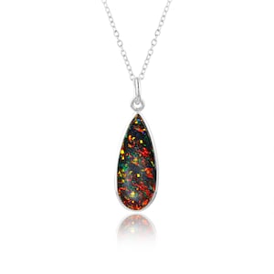 May include: A silver chain necklace with a teardrop-shaped pendant featuring a black opal with red, green, and yellow flashes.