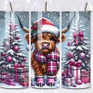 May include: A festive Christmas-themed tumbler featuring a Highland cow wearing a Santa hat and scarf, standing in front of a snowy Christmas tree with pink ornaments and presents.