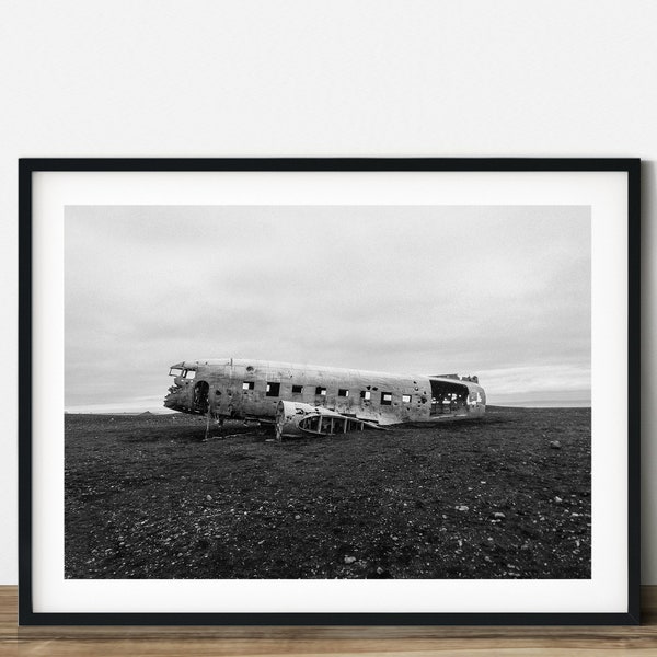 A wrecked plane on the filed at Iceland black and white travel photography.  Printable wall art. Ready made to print out for any ratio.