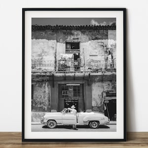 A driver waiting at old car in Havana black and white street photography.  Printable wall art. Ready made to print out for any ratio.