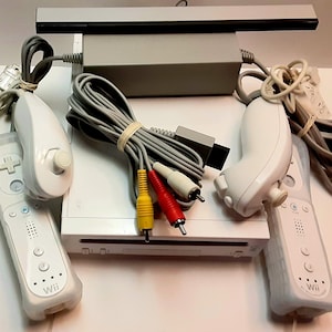 Wii game system Pre- Owned (As is) All tested , in working condition. Nice system.