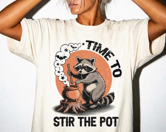 Funny Raccoon Witch Halloween Shirt | Stir The Pot Comfort Colors Tee
