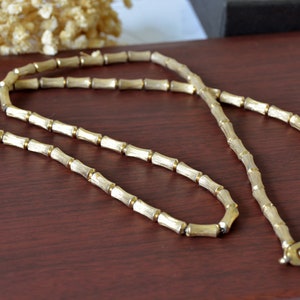 Collana vintage con perline color oro: catena testurizzata anni &#39;70