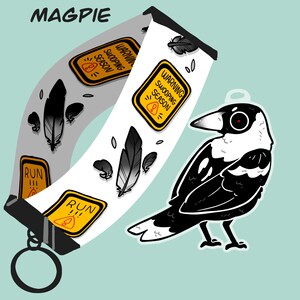 May include: A black and white cartoon magpie with a red eye, perched on a branch. The magpie is holding a sign that says "Warning swooping season". The sign is yellow with black text. The magpie is also holding a sign that says "Run!!!". The sign is yellow with black text. The magpie is also holding a sign that says "Warning swooping season". The sign is yellow with black text.