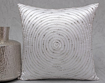 white beaded pillow