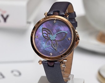 Purple Butterfly Lady Watch - A Symphony of Elegance. Discover the world’s first handmade watch to tell time with the butterfly wings