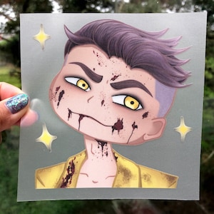 May include: A square, semi-transparent sticker featuring a stylized cartoon character with purple hair, yellow eyes, and a yellow jacket. The character has dark red splatters on their face and neck, and two yellow four-pointed star icons.