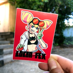 May include: A red sticker with a cartoon illustration of a woman with pink and yellow hair wearing a white lab coat, green gloves, and red goggles. The text "LOCA FEX" is printed in black below the illustration.