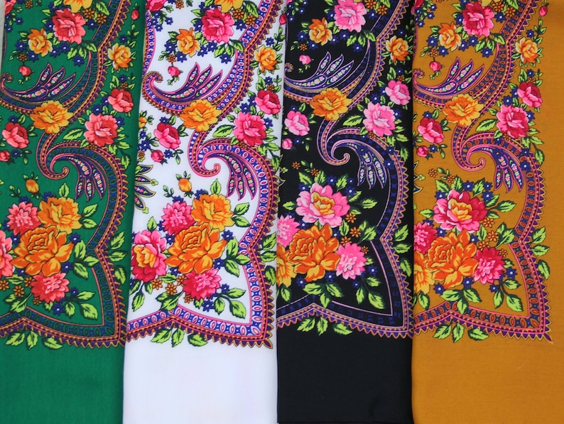 May include: Four fabric swatches with floral patterns. The swatches are green, white, black, and gold. Each swatch has a different floral pattern with a paisley design.