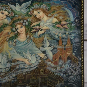 May include: A hand-painted wooden box with a scene of three women with flowing hair and white doves, set against a backdrop of a city with a church steeple. The box is decorated with a gold border and the artist's signature.
